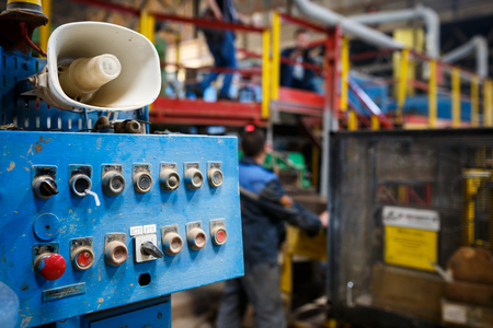 Start or stop button for industrial machine, close-up. Emergency Stop for Safety concept. Red emergency stop switch and green reset button in factoryの写真素材