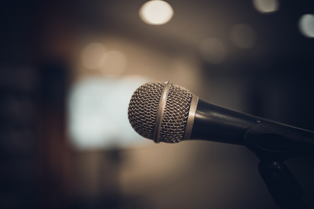 microphone in concert hall or conference room soft and blur style for backgroundの写真素材