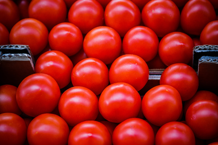 Delicious red tomatoes. Summer tray market agriculture farm full of organic vegetables It can be used as background.の写真素材