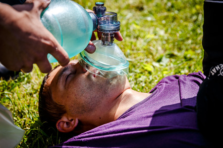 MINSK, BELARUS - 2 JUNE, 2018: making cardiopulmonary resuscitation to an unconscious guy after heart attackのeditorial素材