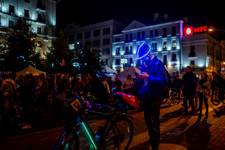 MINSK, BELARUS - 1 OKTOBER, 2018: Group of cyclists at the event riding at the night streets with lamps and lightsのeditorial素材