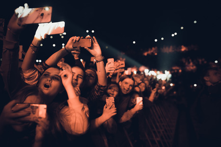 MINSK, BELARUS - 20 SEPTEMBER, 2018: Crowd at concert - retro style photoのeditorial素材