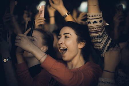 MINSK, BELARUS - 20 SEPTEMBER, 2018: Crowd at concert - retro style photoのeditorial素材