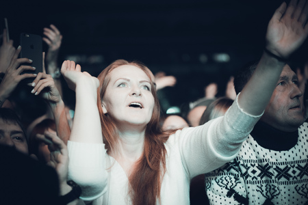 MINSK, BELARUS - DECEMBER 1, 2018: many people having fun at a rock band concert