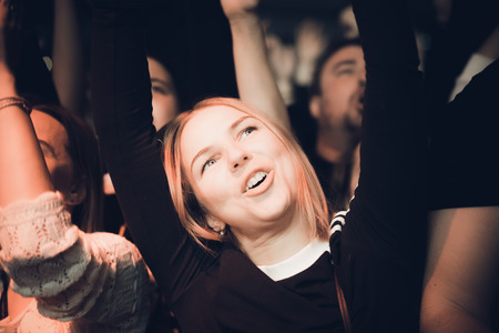MINSK, BELARUS - DECEMBER 1, 2018: many people having fun at a rock band concertのeditorial素材