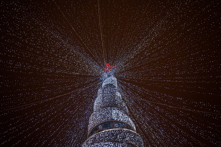 beautiful christmas tree in the city center at nightの写真素材