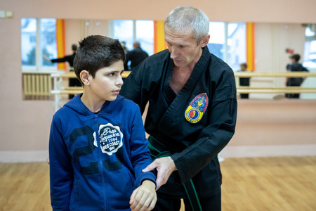 MINSK, BELARUS - 25 DECEMBER, 2018: children train with martial arts trainer viet daoのeditorial素材
