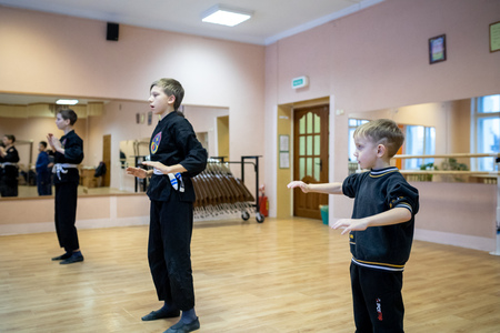 MINSK, BELARUS - 25 DECEMBER, 2018: children train with martial arts trainer viet daoのeditorial素材