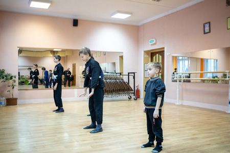 MINSK, BELARUS - 25 DECEMBER, 2018: children train with martial arts trainer viet daoのeditorial素材