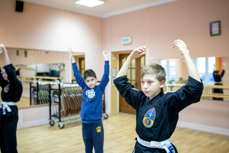 MINSK, BELARUS - 25 DECEMBER, 2018: children train with martial arts trainer viet daoのeditorial素材