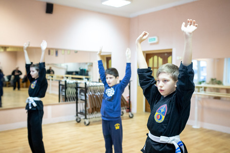MINSK, BELARUS - 25 DECEMBER, 2018: children train with martial arts trainer viet daoのeditorial素材