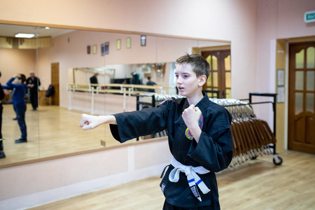 MINSK, BELARUS - 25 DECEMBER, 2018: children train with martial arts trainer viet daoのeditorial素材