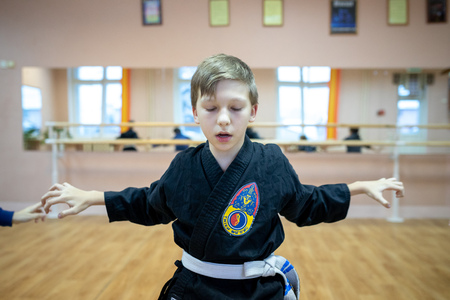 MINSK, BELARUS - 25 DECEMBER, 2018: children train with martial arts trainer viet daoのeditorial素材