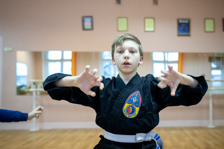 MINSK, BELARUS - 25 DECEMBER, 2018: children train with martial arts trainer viet daoのeditorial素材