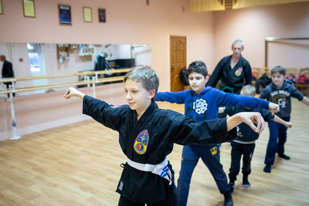 MINSK, BELARUS - 25 DECEMBER, 2018: children train with martial arts trainer viet daoのeditorial素材