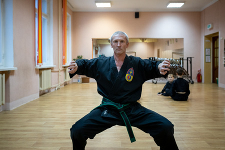 MINSK, BELARUS - 25 DECEMBER, 2018: children train with martial arts trainer viet daoのeditorial素材