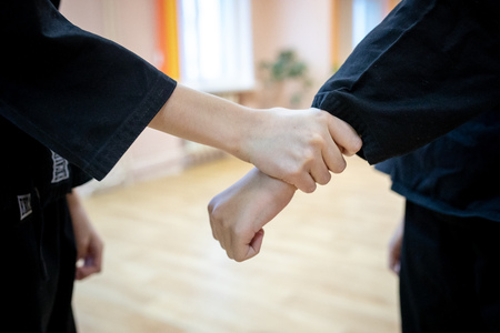 MINSK, BELARUS - 25 DECEMBER, 2018: children train with martial arts trainer viet daoのeditorial素材