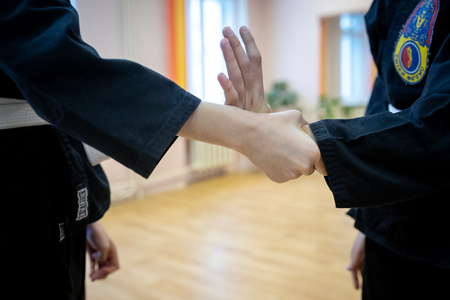 MINSK, BELARUS - 25 DECEMBER, 2018: children train with martial arts trainer viet daoのeditorial素材