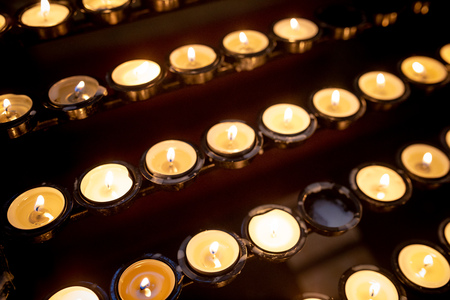 Many burning candles with shallow depth of fieldの写真素材