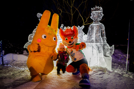MINSK, BELARUS - 20 JANUARY, 2018: the mascot of the II European games fox Lesik is photographed with adults and childrenのeditorial素材