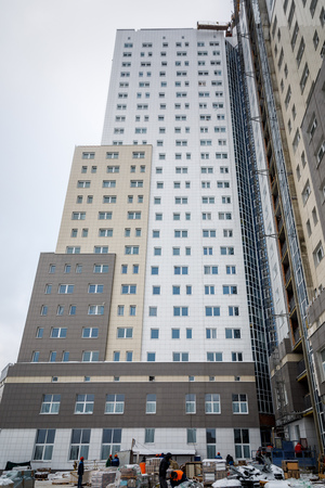 MINSK, BELARUS - 20 JANUARY, 2018: construction workers build a multi-storey residential building in winterのeditorial素材