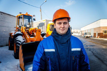 MINSK, BELARUS - 20 JANUARY, 2018: man who is engaged in road repair and asphalting in winterのeditorial素材