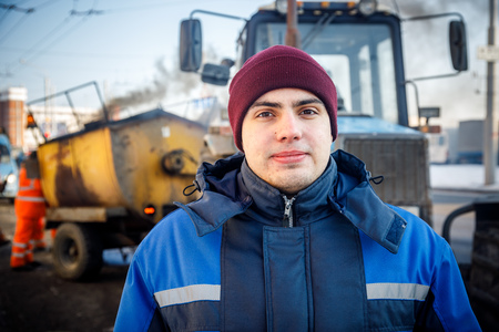 MINSK, BELARUS - 20 JANUARY, 2018: man who is engaged in road repair and asphalting in winterのeditorial素材