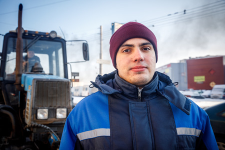 MINSK, BELARUS - 20 JANUARY, 2018: man who is engaged in road repair and asphalting in winterのeditorial素材