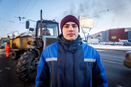MINSK, BELARUS - 20 JANUARY, 2018: man who is engaged in road repair and asphalting in winterのeditorial素材