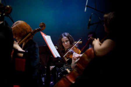 MINSK, BELARUS - 1 APRIL, 2019: Conductor directing symphony orchestraのeditorial素材