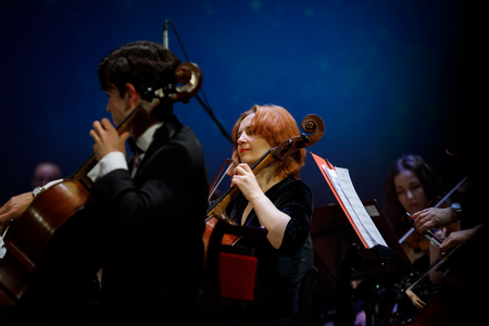 MINSK, BELARUS - 1 APRIL, 2019: Conductor directing symphony orchestraのeditorial素材