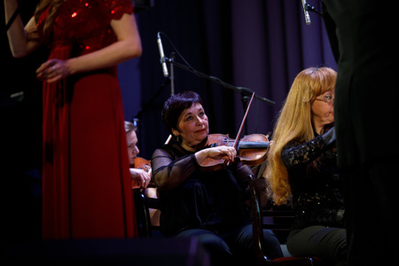 MINSK, BELARUS - 1 APRIL, 2019: Conductor directing symphony orchestraのeditorial素材