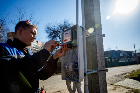 MINSK, BELARUS - 1 APRIL, 2019: electrician checks switchboardのeditorial素材