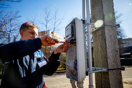 MINSK, BELARUS - 1 APRIL, 2019: electrician checks switchboardのeditorial素材