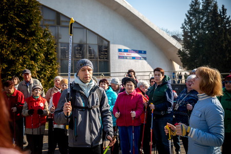 MINSK, BELARUS - 1 MARTH, 2019: older people doing Nordic walking exercisesのeditorial素材