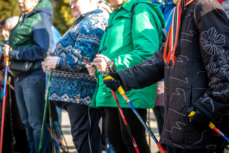 MINSK, BELARUS - 1 MARTH, 2019: older people doing Nordic walking exercisesのeditorial素材
