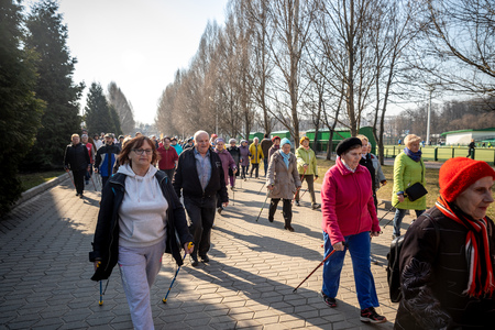 MINSK, BELARUS - 1 MARTH, 2019: older people doing Nordic walking exercisesのeditorial素材