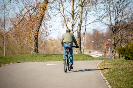 MINSK, BELARUS: children and adults walk in the park and ride roller skates and bicyclesの写真素材