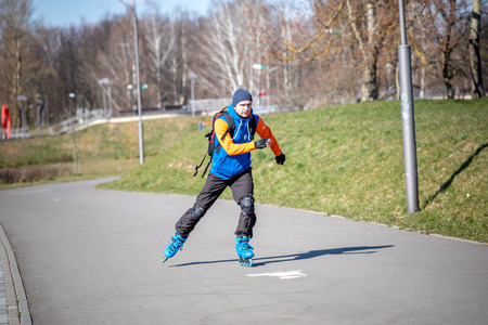 MINSK, BELARUS - 1 MARTH, 2019: children and adults walk in the park and ride roller skates and bicyclesのeditorial素材