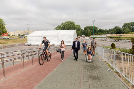 MINSK, BELARUS - 1 JUNE, 2019: a wheelchair user checks the barrier-free environment in the cityのeditorial素材