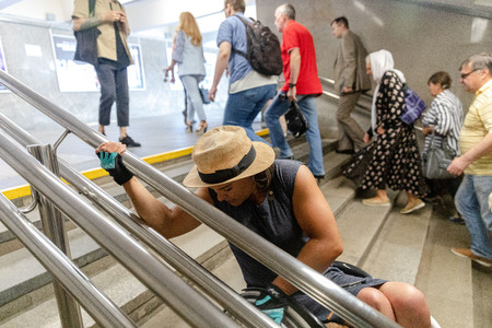 MINSK, BELARUS - 1 JUNE, 2019: a wheelchair user checks the barrier-free environment in the cityのeditorial素材