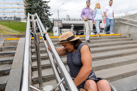 MINSK, BELARUS - 1 JUNE, 2019: a wheelchair user checks the barrier-free environment in the cityのeditorial素材