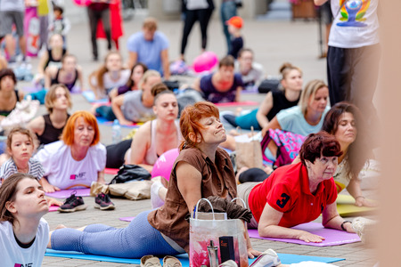 MINSK, BELARUS - 1 JUNE, 2019: many people do yoga in the parkのeditorial素材