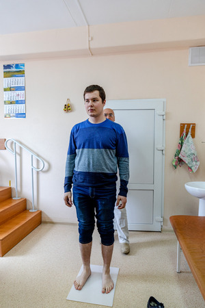 MINSK, BELARUS - 1 JUNE, 2019: man consulting foot doctor in his clinicのeditorial素材