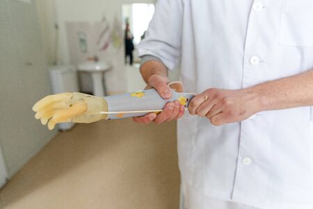 MINSK, BELARUS - 1 JUNE, 2019: surgeon holding prostheticのeditorial素材