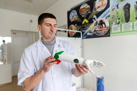 MINSK, BELARUS - 1 JUNE, 2019: surgeon holding prostheticのeditorial素材