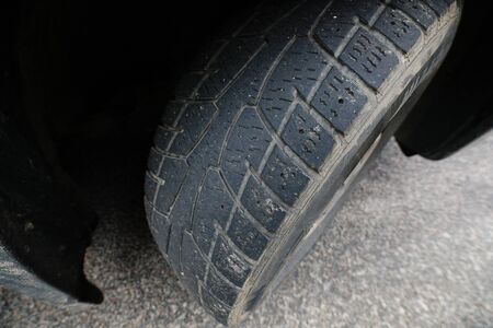 MINSK, BELARUS - February 25, 2020: checking winter tires on an old carの写真素材