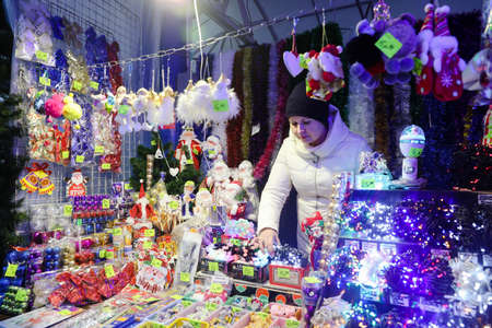 MINSK, BELARUS - February 25, 2020: woman sells Christmas toysのeditorial素材