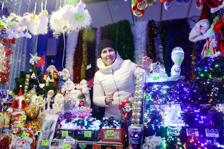 MINSK, BELARUS - February 25, 2020: woman sells Christmas toysのeditorial素材
