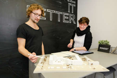 MINSK, BELARUS - February 25, 2020: young architects discussing in office about projectのeditorial素材